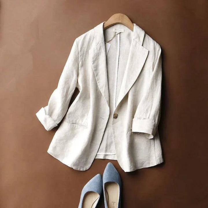 Women's relaxed fit blazer, chic jacket for workwear. Features a notch collar, rolled cuffs & single button closure.
