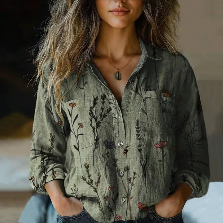 Flowy women's boho top featuring a vibrant vintage print, ideal for comfortable, relaxed summer fashion.