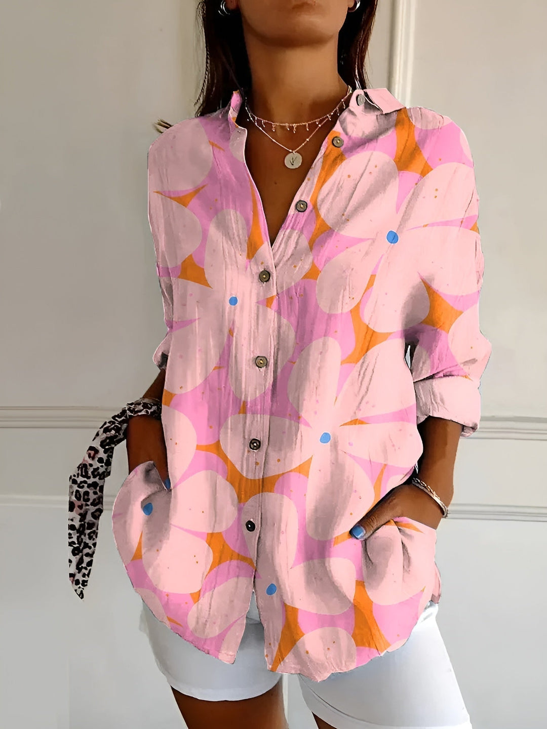 Versatile women's button-down blouse, a relaxed fit long sleeve top suitable for office wear & everyday fashion.