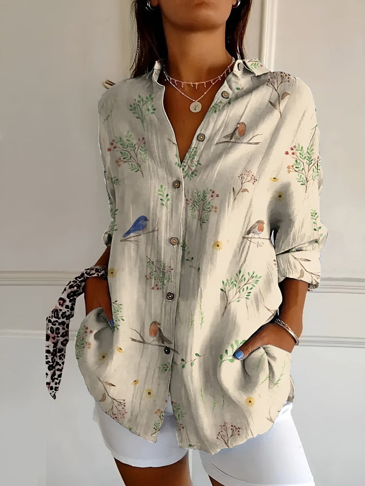 Elegant women's V-neck long sleeve button-down blouse, a comfortable relaxed fit top for any occasion.