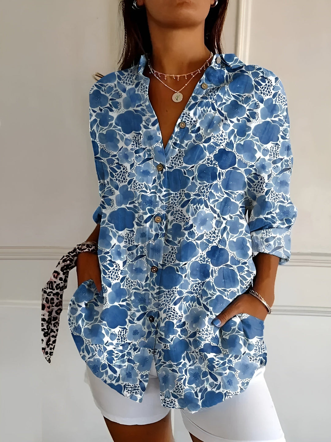 Stylish women's relaxed button-down blouse, an easy-to-style long sleeve top for chic office or casual looks.