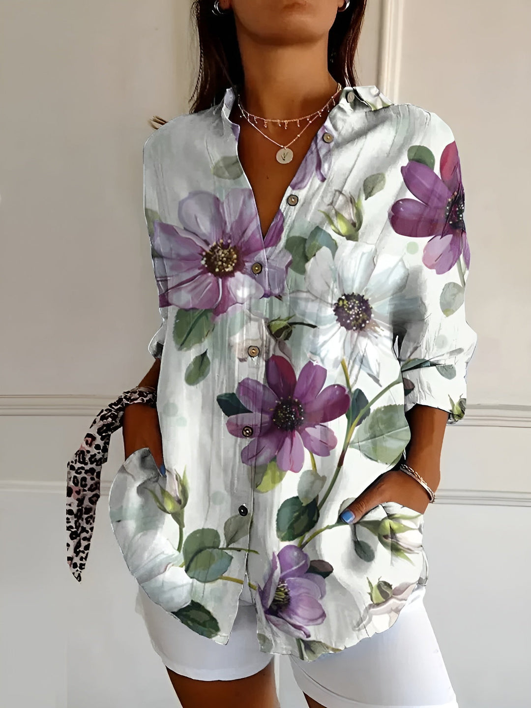 Women's button-down blouse with a relaxed fit and V-neck, a chic long sleeve top for versatile wardrobe styling.