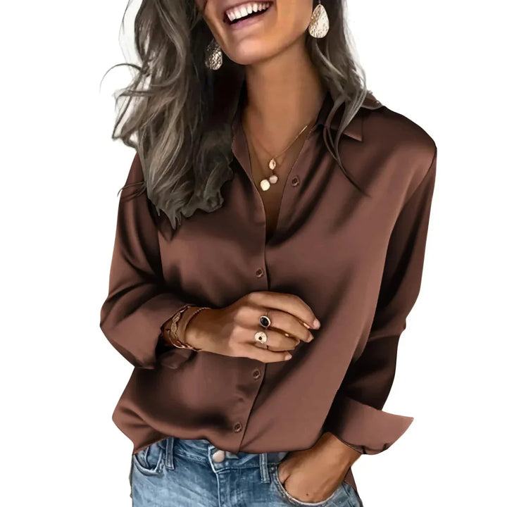 Women's relaxed fit long sleeve button down blouse, a chic and versatile top for various occasions.