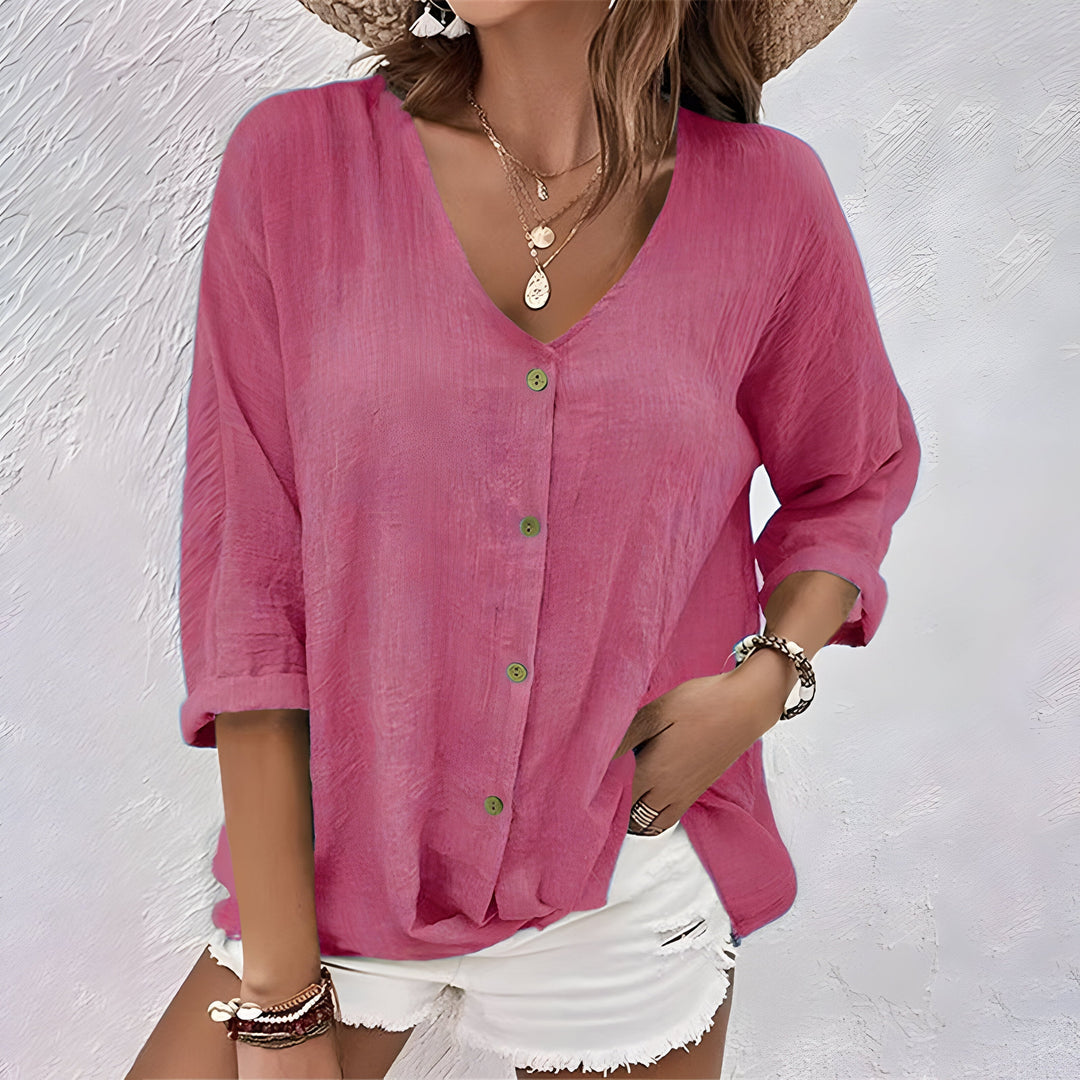 Front view of a women's relaxed fit button-up blouse. Classic long sleeve design, ideal for spring fashion.