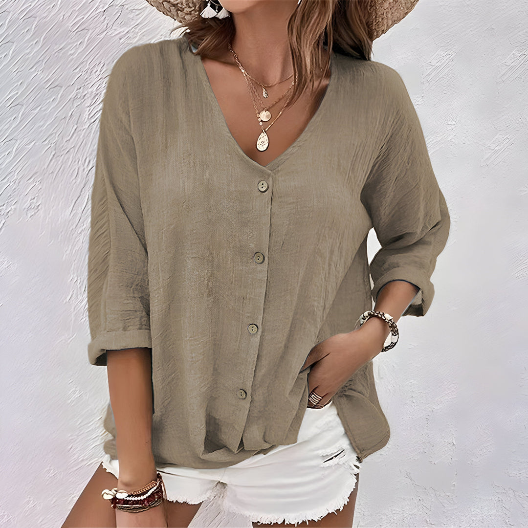 Casual women's button-up top with a relaxed fit. Breathable long sleeve blouse, great for everyday sophistication.