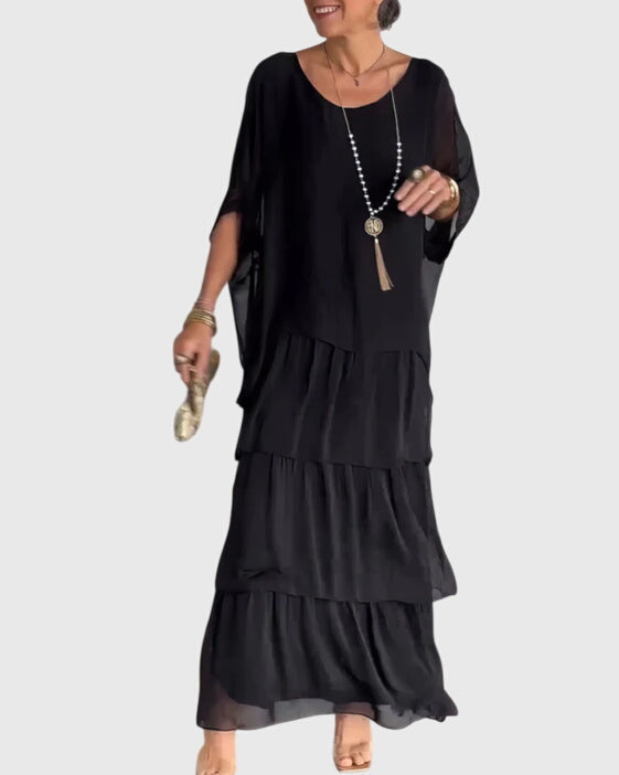 Elegant women's flowing button-up long dress with a relaxed fit for formal events.