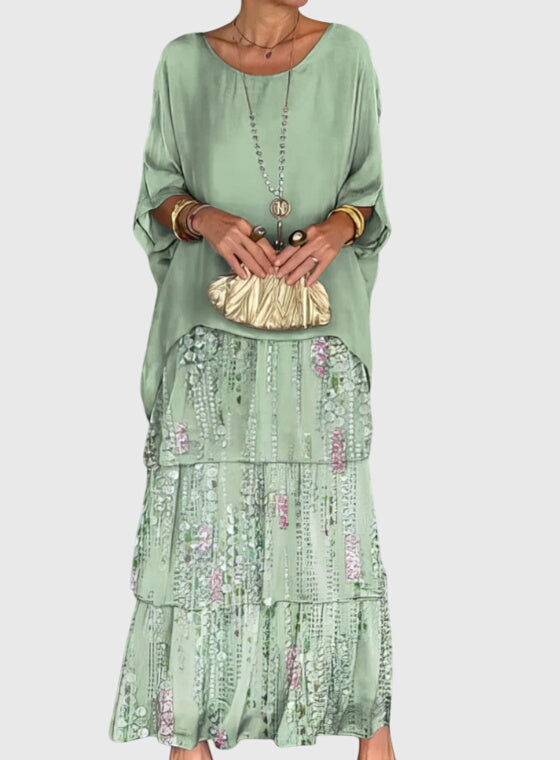 Flowing women's long dress, relaxed fit, button-up detail; perfect formal or wedding guest attire.