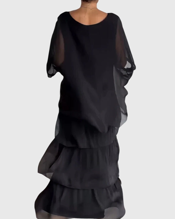 Flowing long button-up maxi dress for women, ideal as a formal event or wedding guest dress.