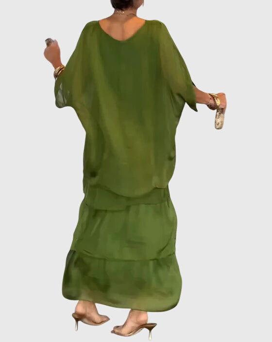 Modest women's long button-up dress with a relaxed fit, suitable for formal events.