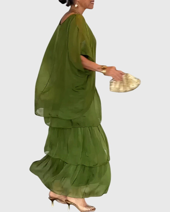 Women's flowing maxi dress, button-up style & relaxed fit for comfortable elegance at events.