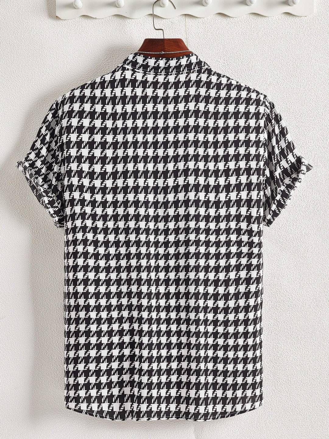 Chic women's button-up shirt with a vibrant floral print. Versatile long sleeve cotton blend top.
