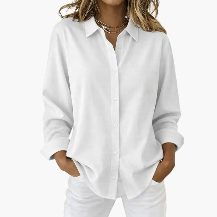 Women's relaxed fit button-up shirt in a classic long sleeve design, perfect for casual or office wear.