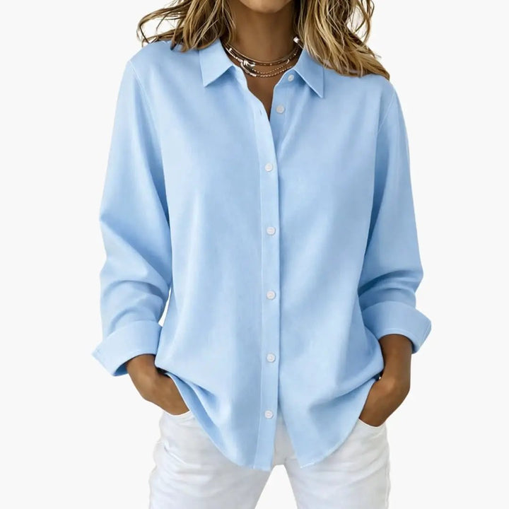 Elegant women's long sleeve button-up top, relaxed fit, a versatile piece for office or casual settings.