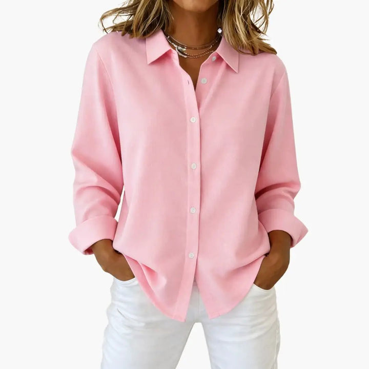 Classic women's button-up shirt with a relaxed fit and long sleeves, great for a polished casual look.