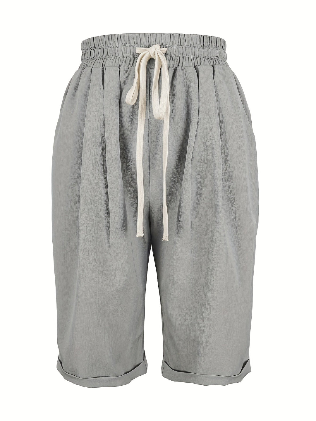 Woman wearing comfortable, lightweight relaxed fit capri trousers with elastic waist, ideal for summer.