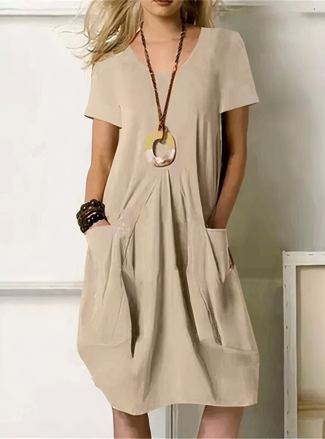 Relaxed fit women's casual swing dress with practical side pockets. Perfect for comfortable, versatile everyday summer style.