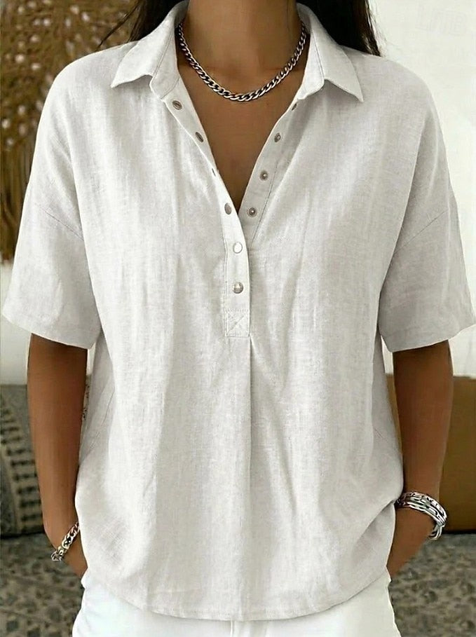 Modern women's relaxed fit shirt with button detail, perfect for a casual yet refined look.