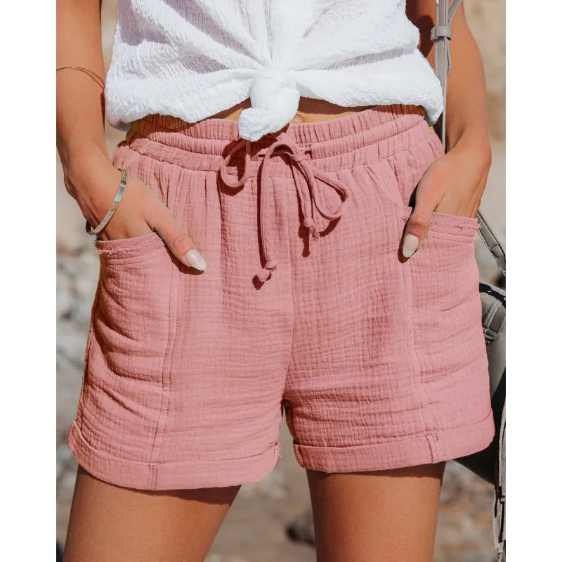 Women's relaxed fit drawstring shorts with practical pockets, ideal for comfy everyday wear.