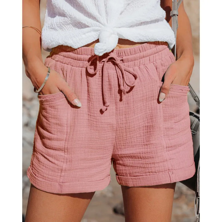 Women's relaxed fit drawstring shorts with practical pockets, ideal for comfy everyday wear.