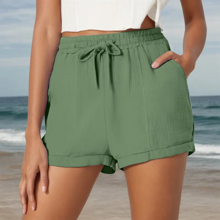 Lightweight women's casual shorts, relaxed fit with drawstring closure & side pockets, great for active summer days.