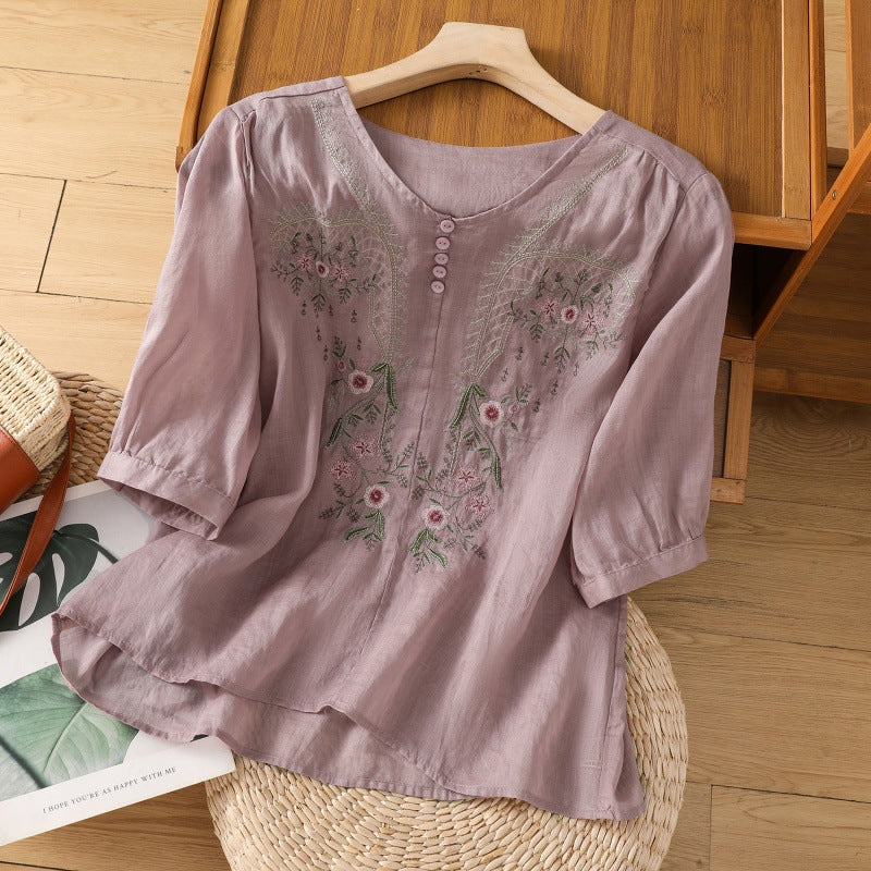 Comfortable relaxed fit women's top featuring delicate floral embroidery and long sleeves for spring fashion.