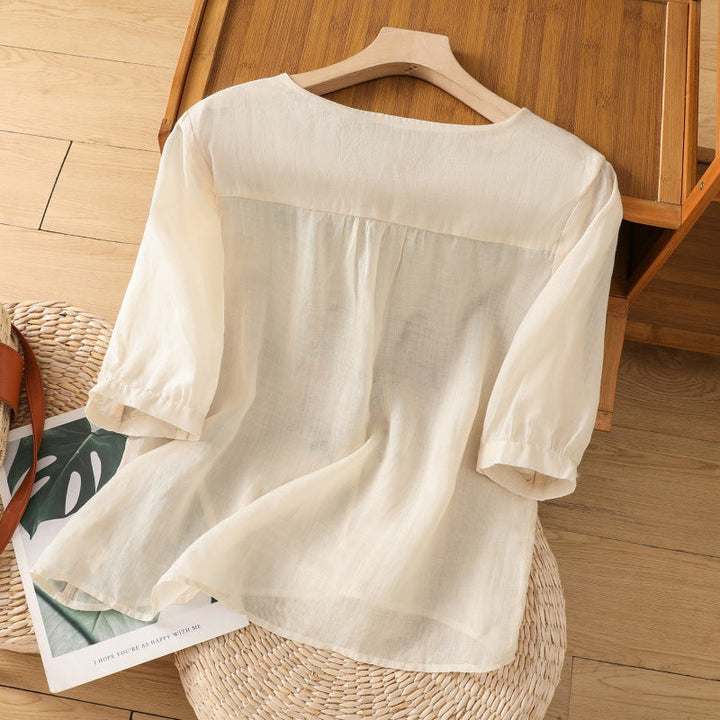 Stylish women's floral embroidered relaxed blouse, a versatile long sleeve top for spring and summer casual wear.