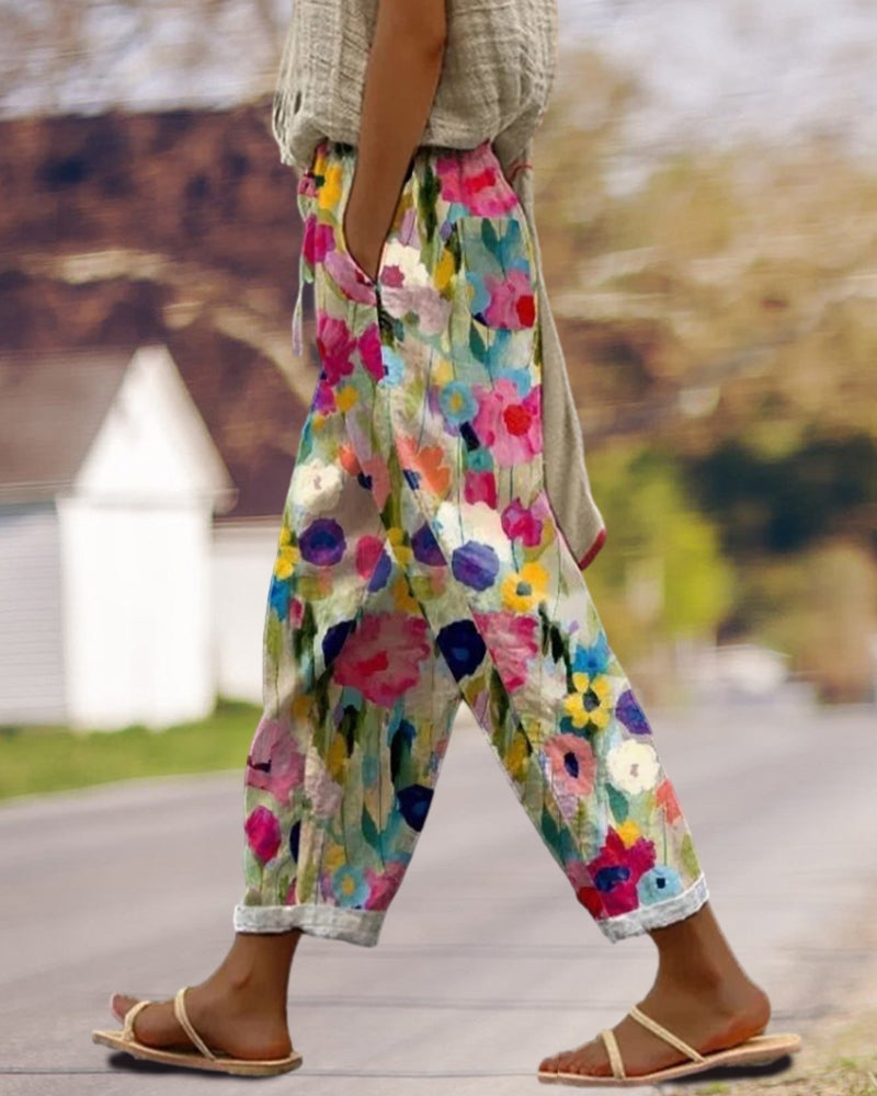 Comfortable women's floral print relaxed fit cropped trousers. Ideal for casual wear, summer, and vacation apparel.