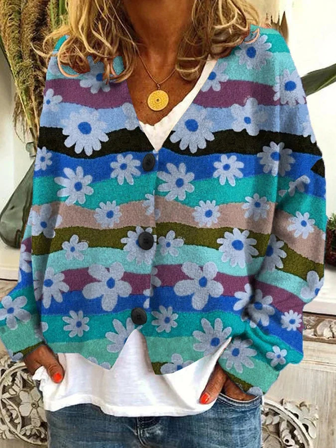 Relaxed fit women's cardigan featuring a unique floral & stripe print. Button-up for versatile, stylish wear.
