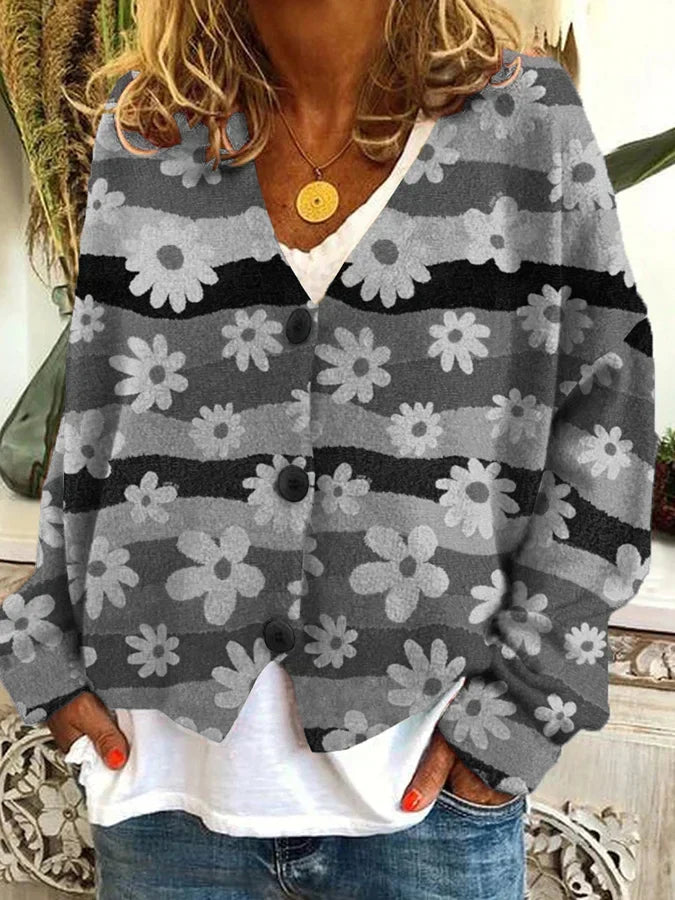 Stylish women's relaxed fit cardigan. Features a trendy floral stripe pattern and button-up front, perfect for layering.