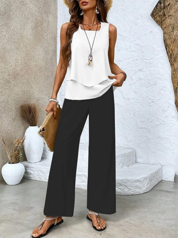 Stylish women's comfortable flowy pants and tank top 2-piece set, perfect for summer vacation or loungewear.
