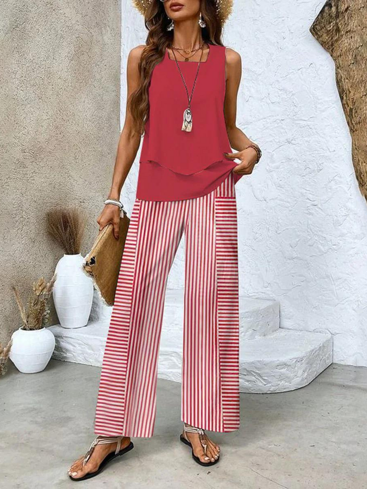 Model in women's relaxed fit flowy wide leg pants & sleeveless tank top 2-piece set. Ideal for summer style.
