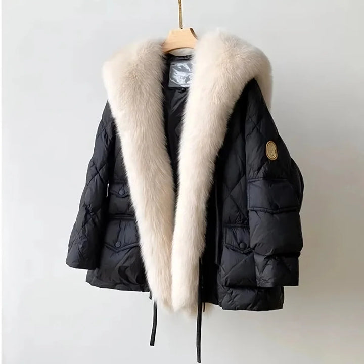 Women's relaxed fit fur collar jacket. Stylish, warm outerwear perfect for fall and winter fashion. Elegant long sleeve coat.