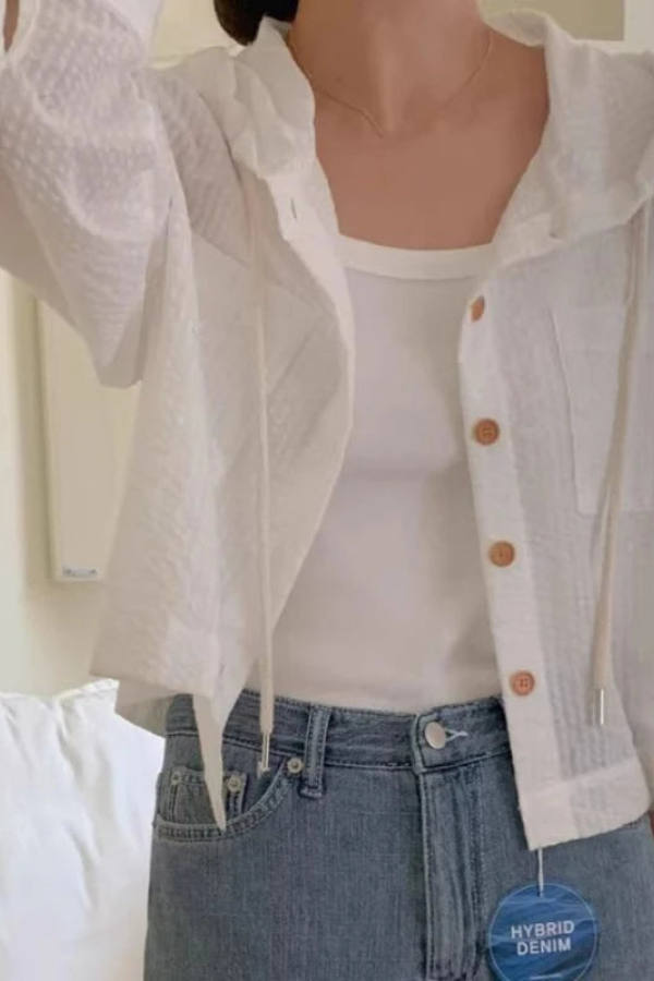 Women's relaxed fit hooded blouse, perfect for casual summer style. Lightweight long-sleeve top for comfort.