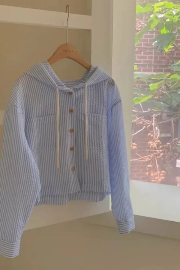 Versatile women's relaxed fit hooded blouse, a comfortable long-sleeve top for everyday casual summer wear.