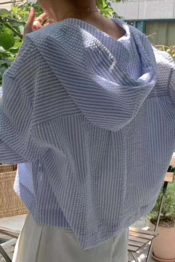 Back view of women's relaxed fit hooded blouse, showcasing the loose, comfortable design for summer fashion.