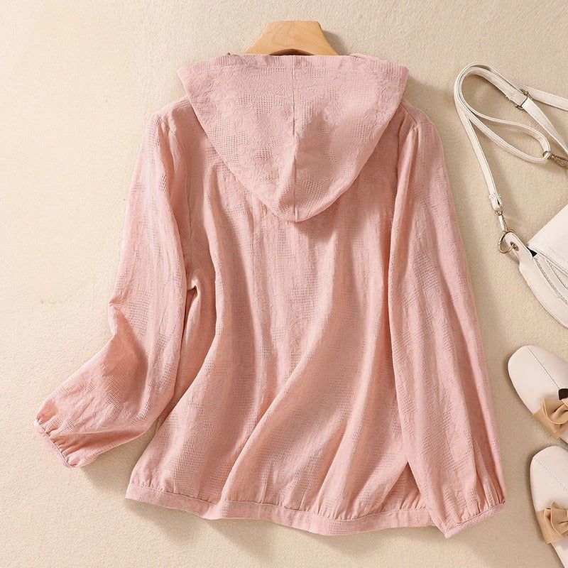 Lightweight women's hooded shirt, ideal for spring layering. Relaxed fit for comfortable, casual wear.