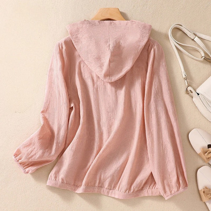 Lightweight women's hooded shirt, ideal for spring layering. Relaxed fit for comfortable, casual wear.
