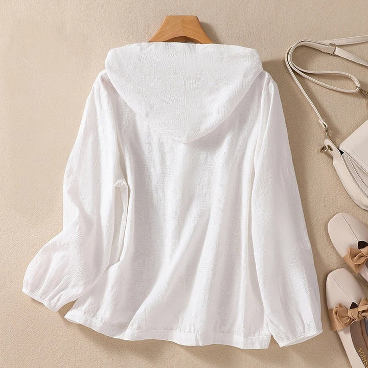 Comfortable long-sleeve hooded shirt for women. Relaxed fit blouse, perfect for everyday casual styling.