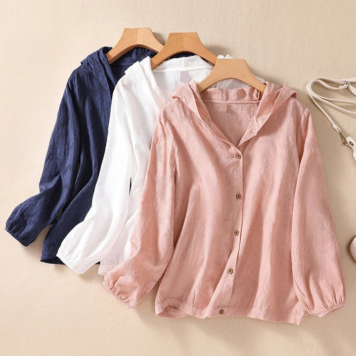 Modern women's hooded shirt with a relaxed fit for comfortable everyday casual wear. A versatile layering top.