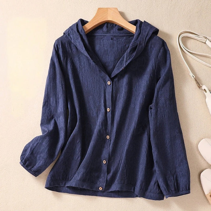 Women's relaxed fit hooded blouse offering effortless comfort and versatile styling for casual everyday wear.