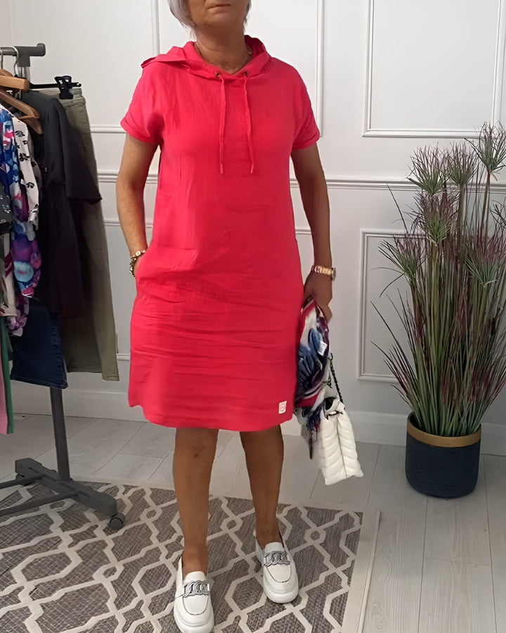 Women's relaxed fit hoodie midi dress with adjustable hood for comfortable, casual everyday wear.