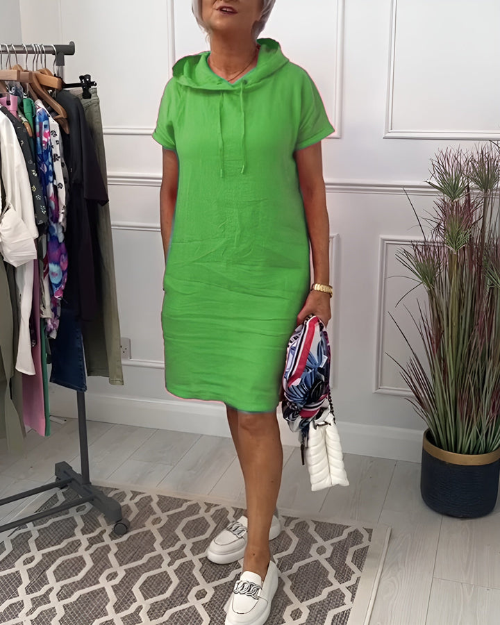 Fashion-forward women's relaxed fit hoodie midi dress with adjustable hood, perfect for casual style.