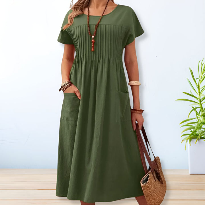 Women's relaxed fit midi day dress with short sleeves & pockets. Perfect for comfortable, casual summer style.