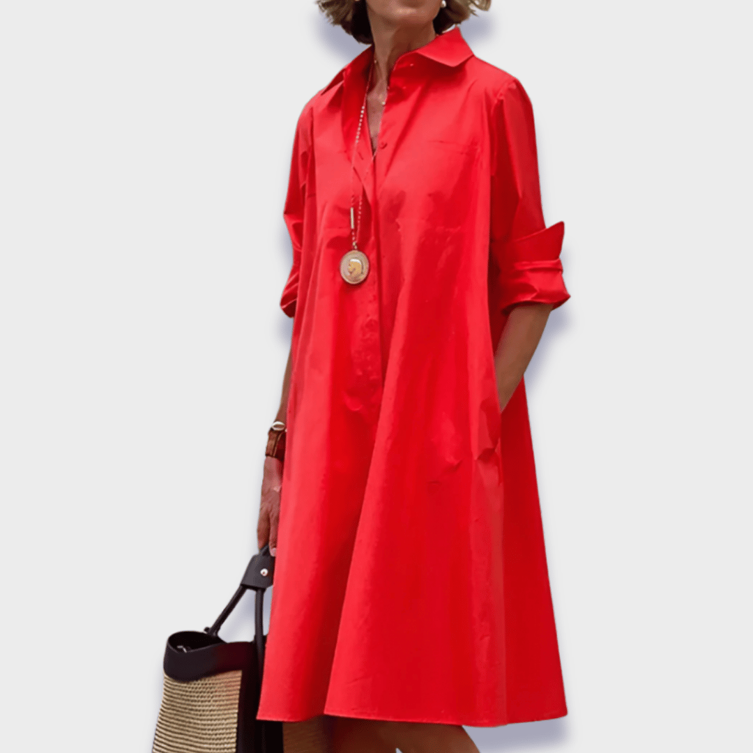 Women's relaxed fit midi shirt dress with functional button-up front and practical side pockets, ideal for spring.