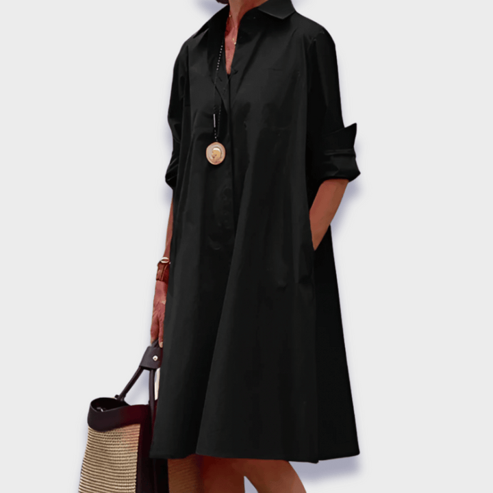 Chic women's button-up midi shirt dress in a relaxed, flowy style with pockets, perfect for summer casual elegance.