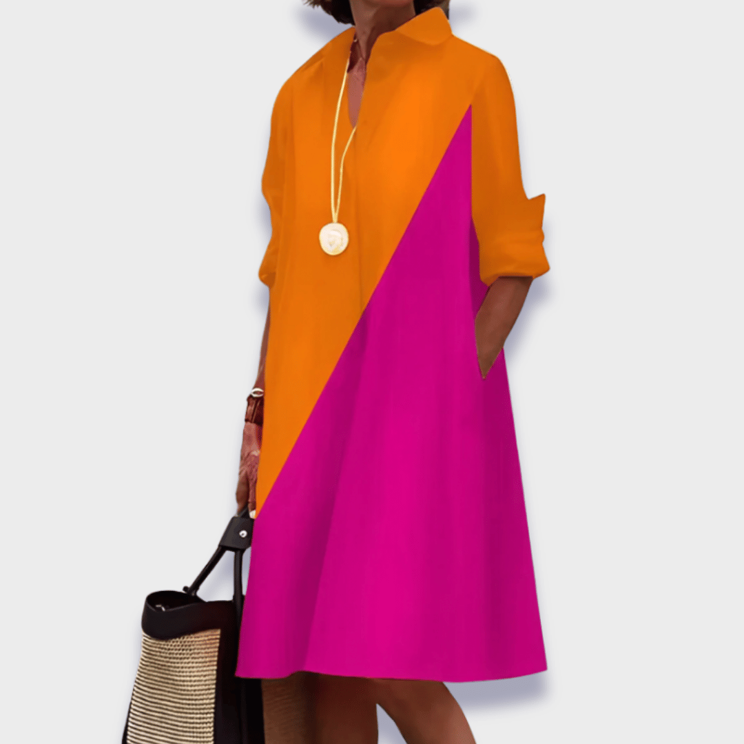 Comfortable women's relaxed button-up midi dress with a stylish collared design & convenient pockets, great for casual.