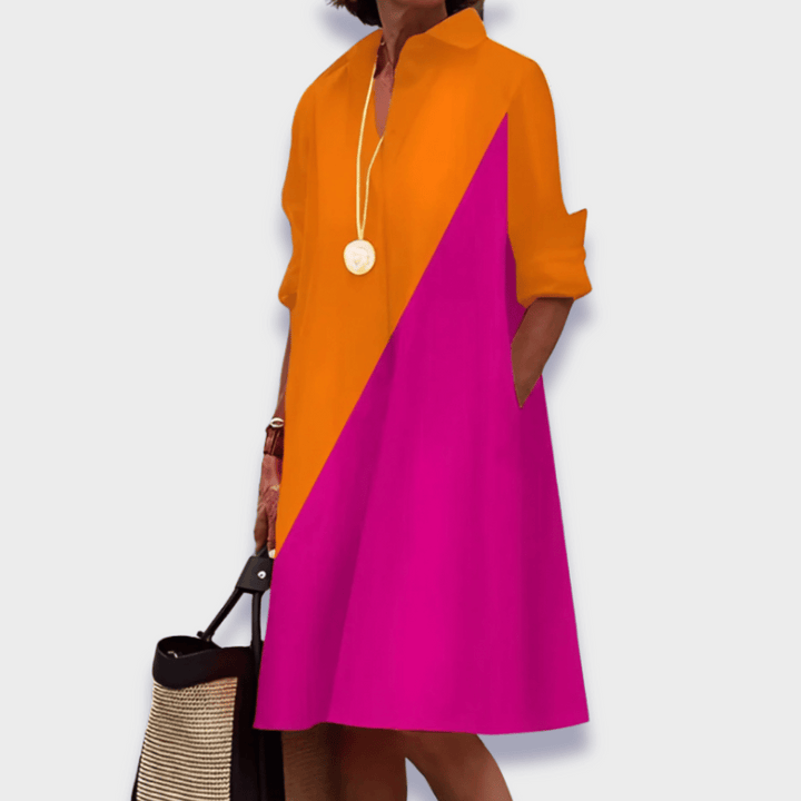 Comfortable women's relaxed button-up midi dress with a stylish collared design & convenient pockets, great for casual.