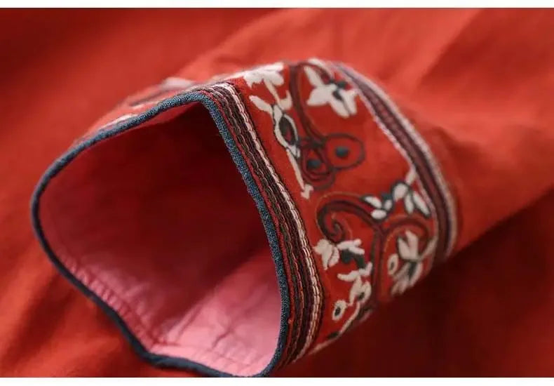Red patterned v-neck blouse. Ladies' relaxed fit top for spring/summer fashion.