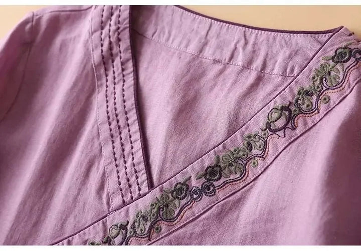 Vibrant purple patterned v-neck blouse. Relaxed fit women's elegant top.