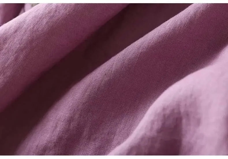 Soft pink patterned v-neck blouse. Women's relaxed fit for spring fashion.